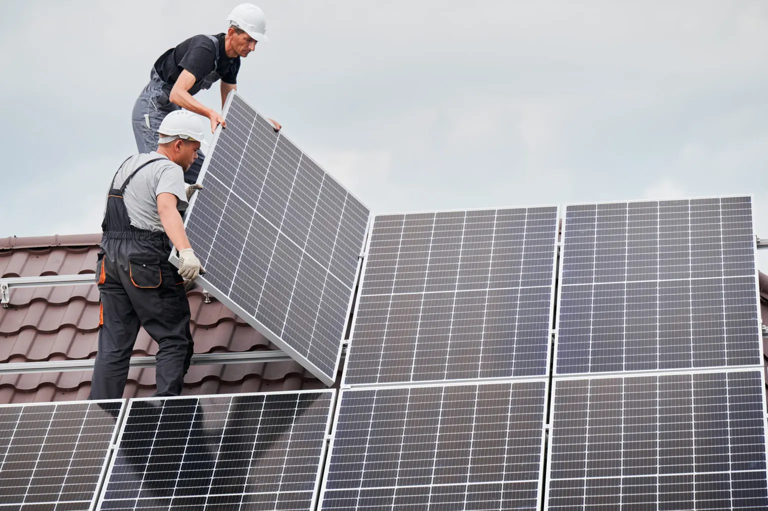 contractors placing solar panels