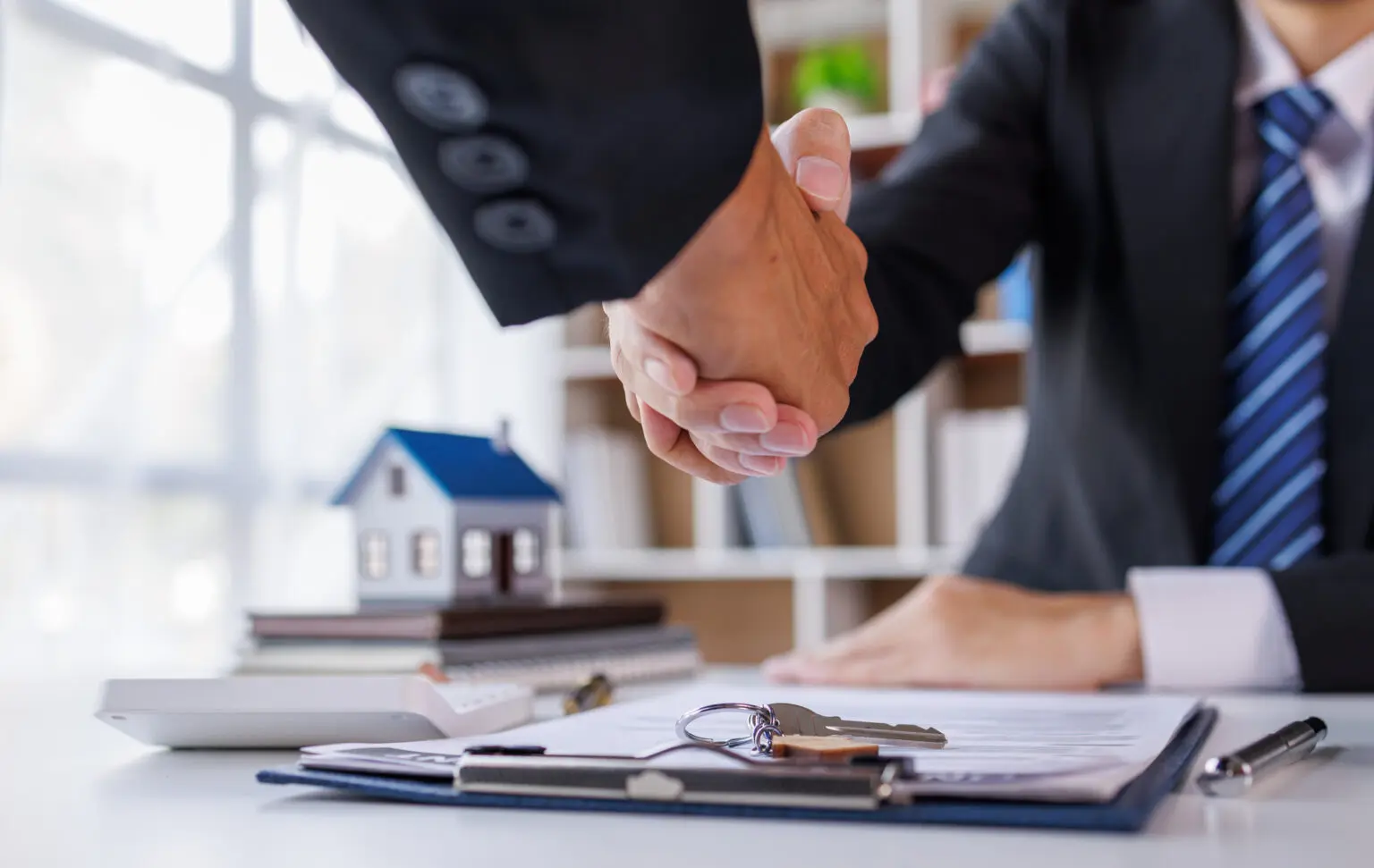 estate agents shaking hands